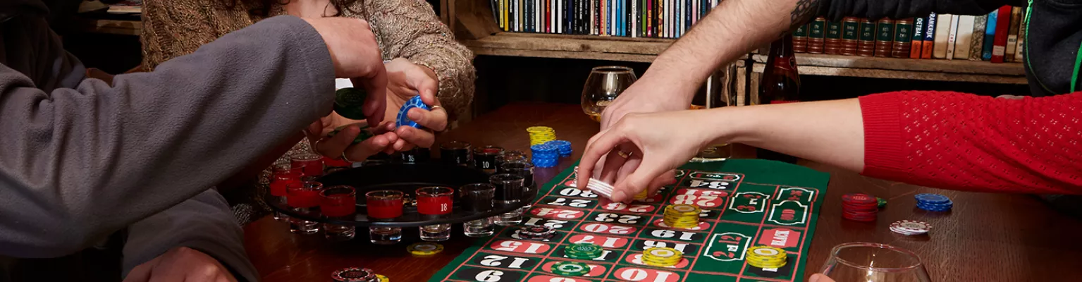 People play a poker game with personalised Game Tokens