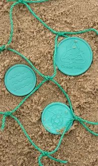 Tokens made from recycled fishing nets
