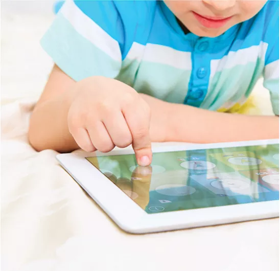 Kid using a Smart Tokens in combination with a digital application