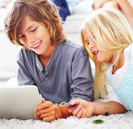 Kids using Smart Tokens with a digital app